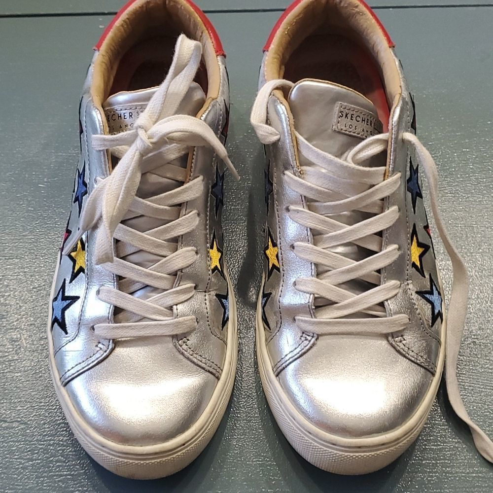 Sketchers,  7.5..tie sneakers. Silver with red,yellow & blue stars. Great..